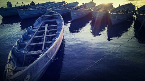 Boats moored at harbor