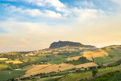 Scenic view of agricultural field against sky