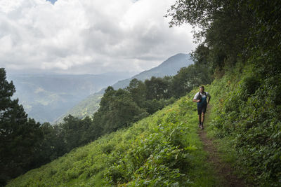 One man running on a trail in the mountains of zacatlan