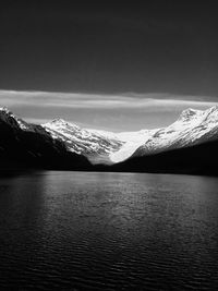 Scenic view of snow covered mountains against sky