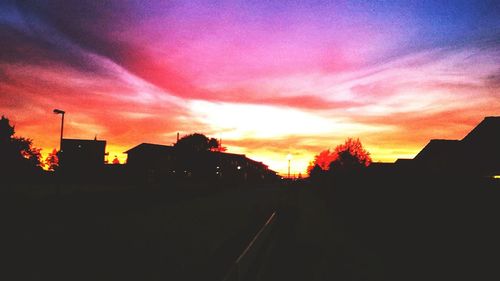 Car on road at sunset