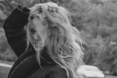 Portrait of young woman outdoors