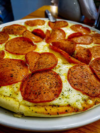 Close-up of pizza served in plate