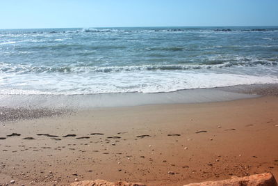 Scenic view of beach against sky