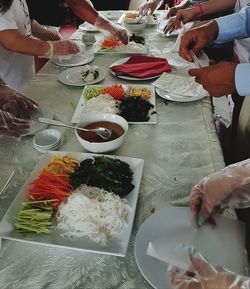 High angle view of people on table