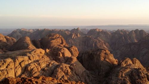 Scenic view of rock formations against sky