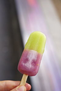 Close-up of hand holding ice cream