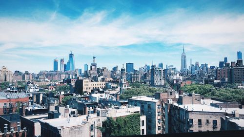 High angle view of city buildings against sky