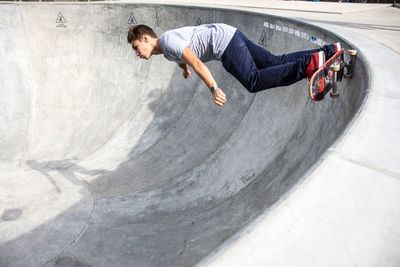 Full length of man skateboarding in park