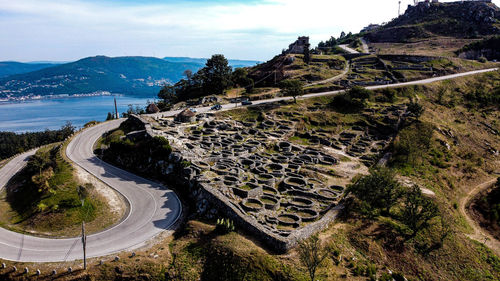 High angle view of road amidst mountains against sky