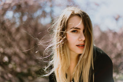 Portrait of beautiful young woman outdoors