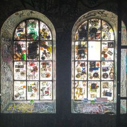 Graffiti on glass window of building