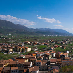 Aerial view of townscape against sky