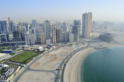 Aerial view of cityscape against sky