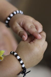 Close-up of woman holding hands