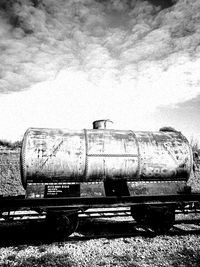 Abandoned car against sky