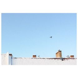 Low angle view of built structure against clear blue sky