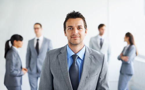 Portrait of businessman standing at office