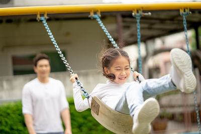 Full length of a smiling girl on playground