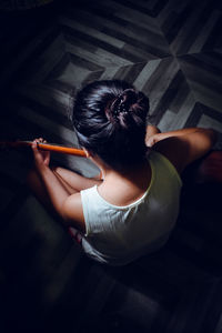 High angle view of woman sitting at home