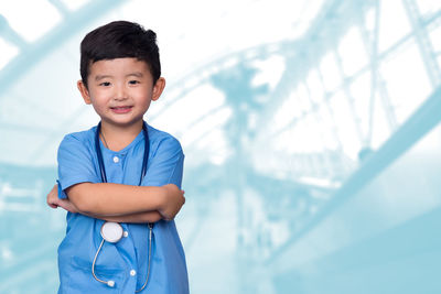 Portrait of boy standing outdoors