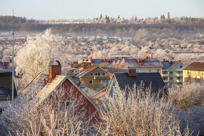 High angle view of houses and buildings in city