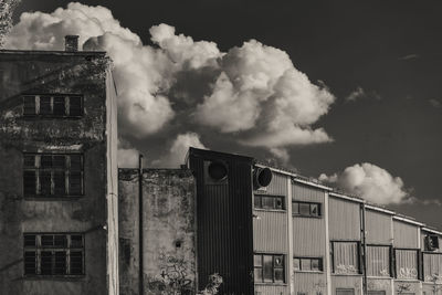 Low angle view of abandoned building against sky