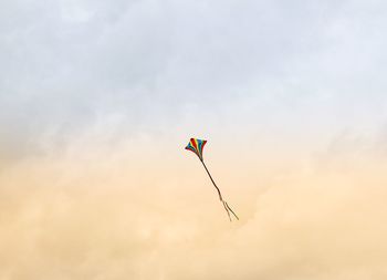 Low angle view of kite flying in sky