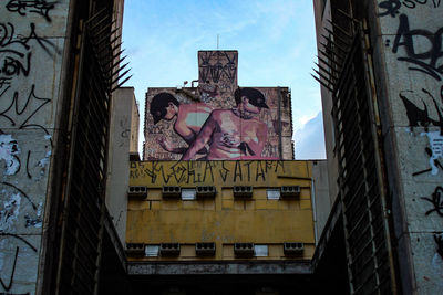Low angle view of graffiti on abandoned building