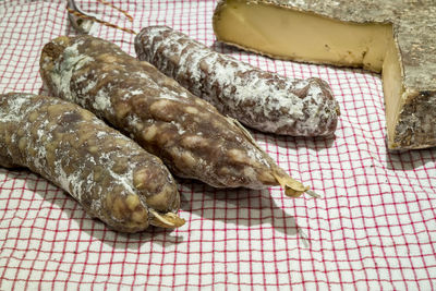 High angle view of cheese on tablecloth