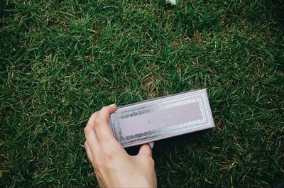 Cropped image of man standing on grassy field
