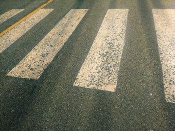 High angle view of arrow sign on road