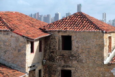 Houses against sky in city