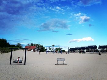 Low angle view of beach and buildings against sky