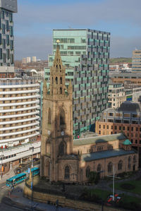 Buildings in city against sky