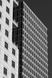 Low angle view of modern building against sky at night