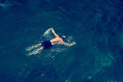 High angle view of person swimming in sea