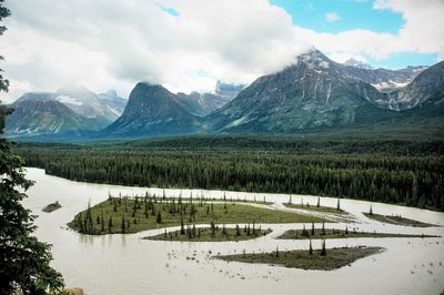 Scenic view of lake and mountains against sky