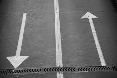 High angle view of arrow symbol on road