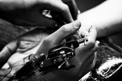 Close-up of hands playing guitar