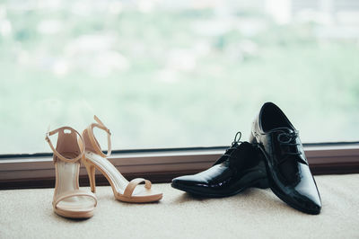 Close-up of shoes on table