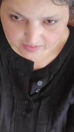 Close-up portrait of smiling mid adult woman