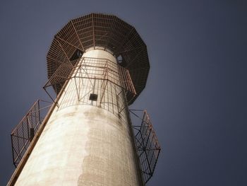 Low angle view of water tower against clear sky