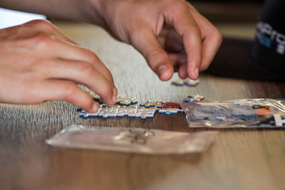 Close-up of people playing with table