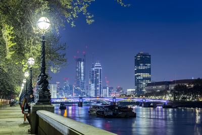 Illuminated buildings in city at night