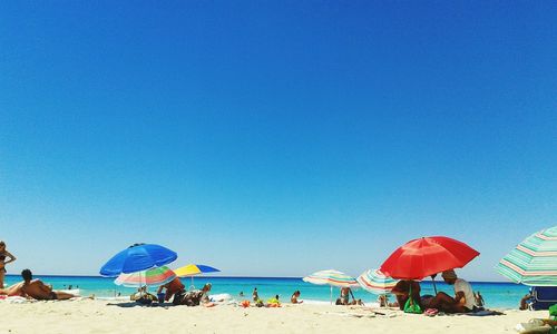 People on sunny beach in spain