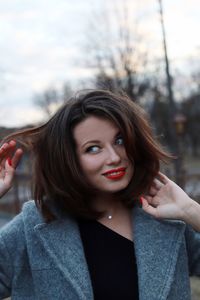 Smiling young woman looking away