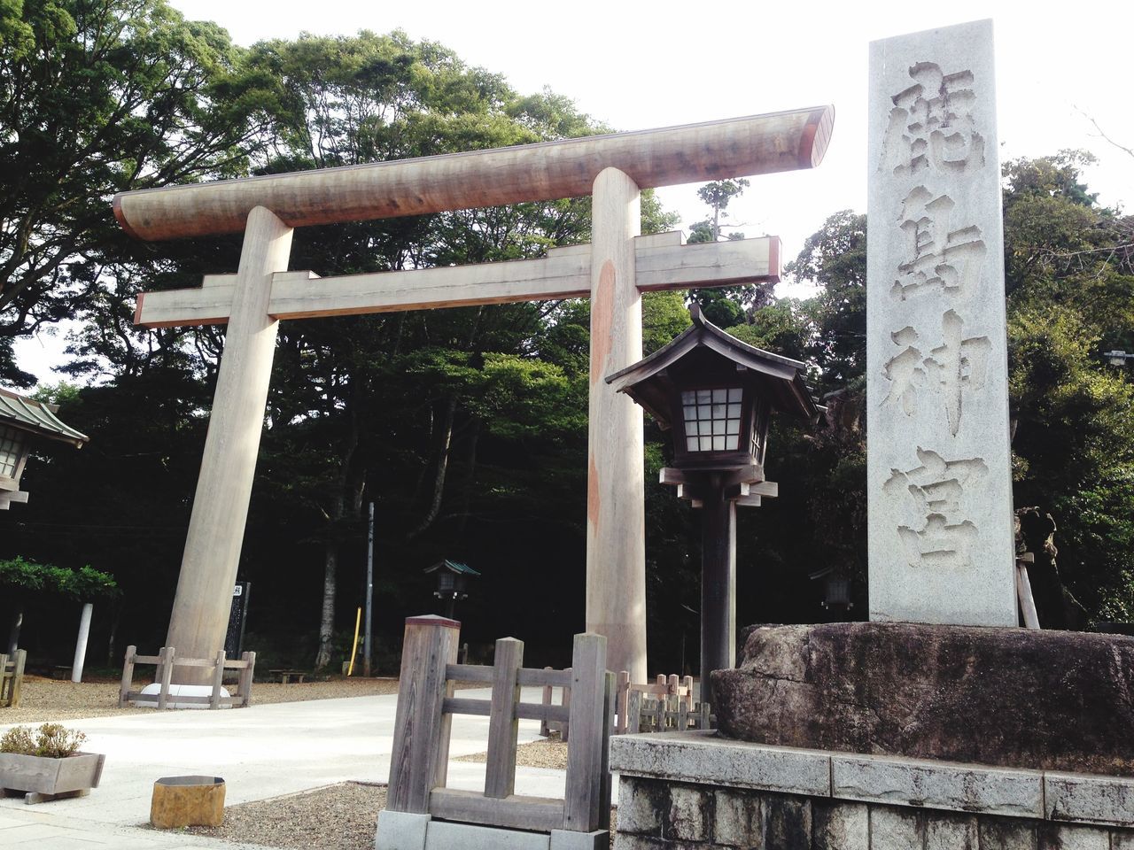 tree, art, art and craft, sculpture, human representation, statue, creativity, park - man made space, built structure, religion, architectural column, cemetery, architecture, spirituality, cross, memorial, gate, day, no people