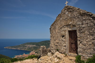 Small medieval stone church on the top of the hill with beautiful view on adriatic coast