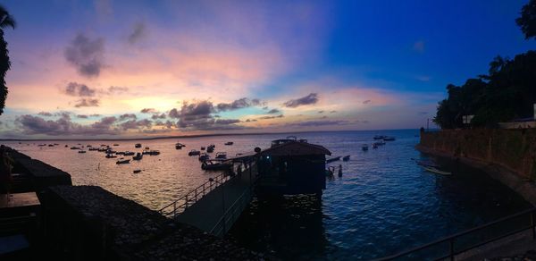 Panoramic view of beach against sky during sunset